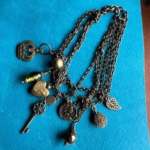 Antiqued key, multi charm bracelet